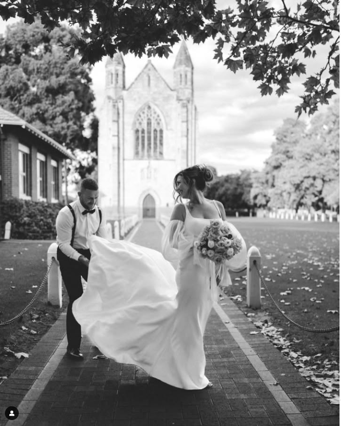 weding photo of couple outside of Guildford church